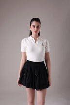 The Etoile Tiered Mini Skirt In Midnight Onyx with Hand-Tied Silk Bow Accents