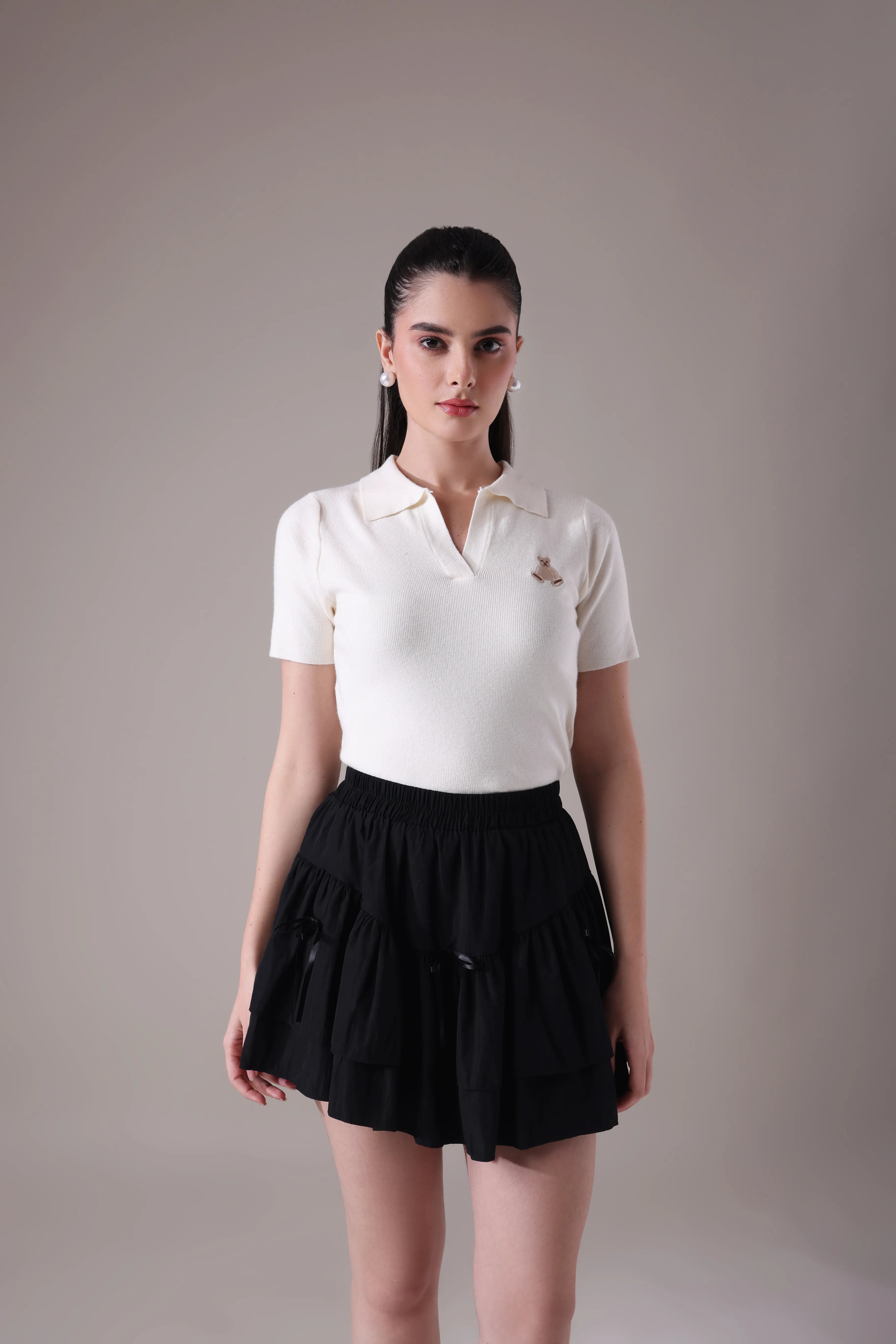 The Etoile Tiered Mini Skirt In Midnight Onyx with Hand-Tied Silk Bow Accents